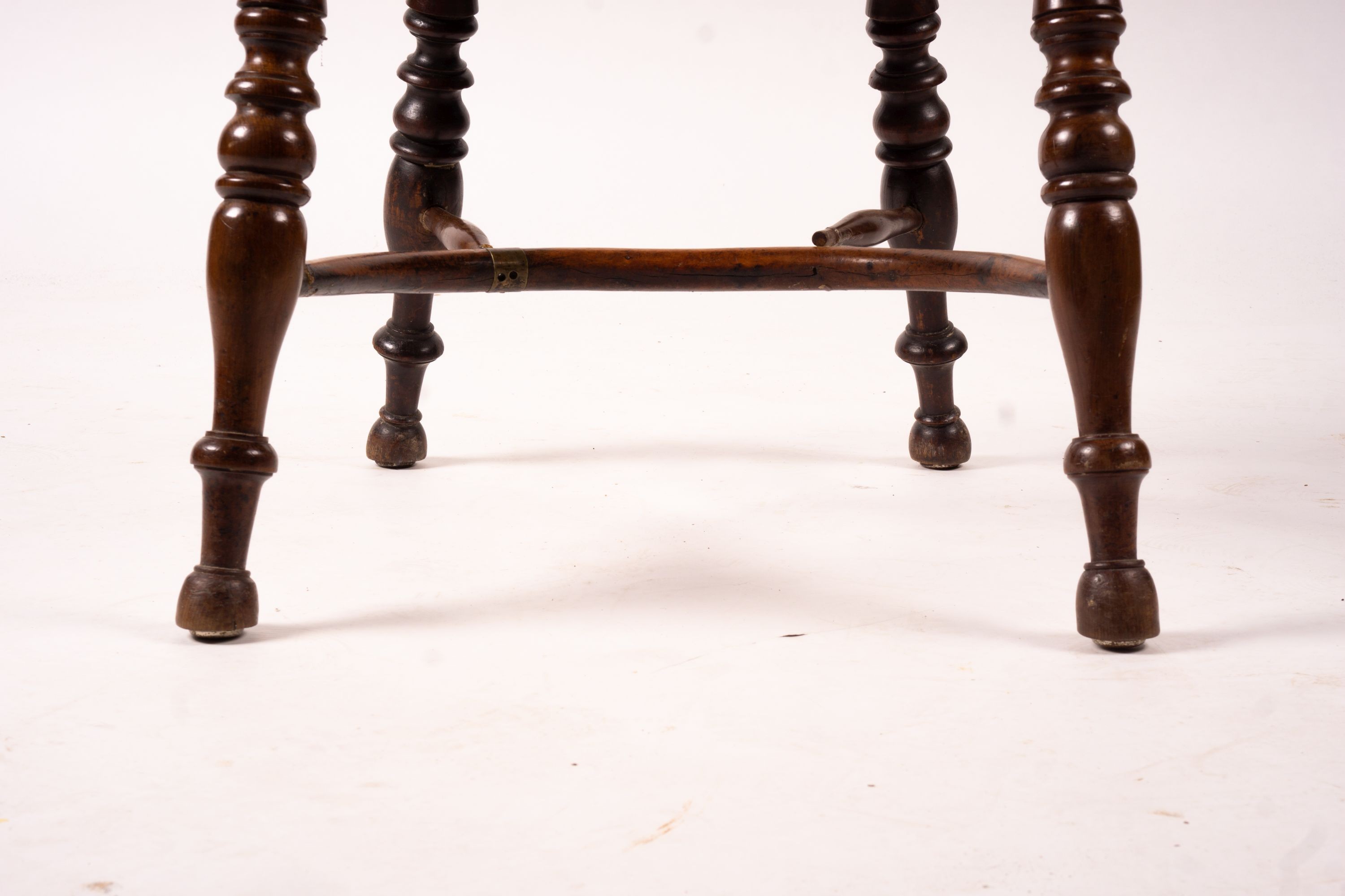 A 19th century yew and elm Yorkshire area Windsor elbow chair with crinoline stretcher, width 60cm, depth 45cm, height 93cm